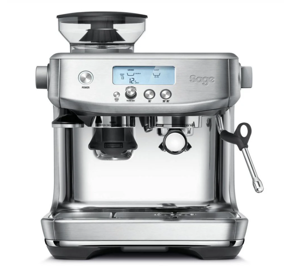 The Sage The Barista Pro Espresso Machine by Sage boasts a sleek stainless steel exterior, digital display, multiple control buttons, right-side steam wand, and features a powerful ThermoJet Heating System for fast brewing. It also includes a top portafilter holder and bean hopper.