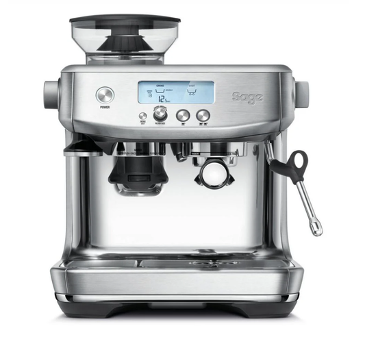 The Sage The Barista Pro Espresso Machine by Sage boasts a sleek stainless steel exterior, digital display, multiple control buttons, right-side steam wand, and features a powerful ThermoJet Heating System for fast brewing. It also includes a top portafilter holder and bean hopper.