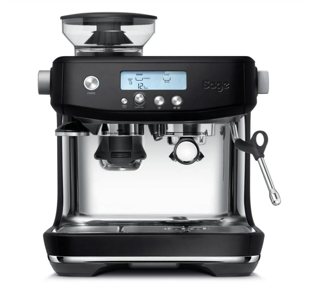 The Sage The Barista Pro Espresso Machine in Black Truffle features a digital display, integrated conical burr grinder, ThermoJet heating system, intuitive buttons, right-side steam wand, and front portafilter holder. An elegant Sage logo adorns the side.