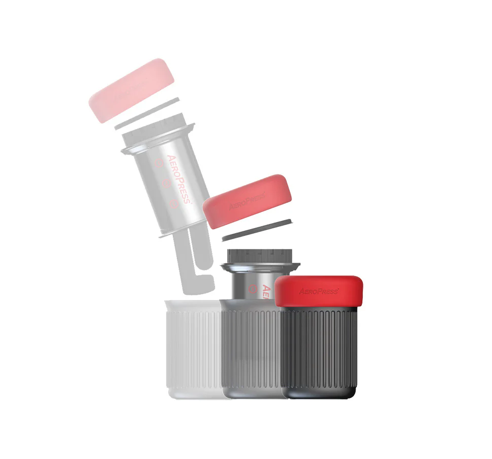A transparent sequence shows an AeroPress GO Travel Coffee Maker by AeroPress with red accents being assembled, ending with the plunger fully inserted into the chamber over a ribbed cup—ideal for fans of compact design.