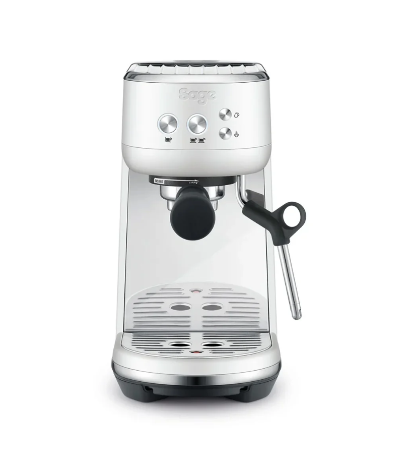 The Sage Bambino Espresso Machine in Sea Salt features a modern, minimalist design with a compact build. It includes a portafilter, steam wand, and intuitive controls. Equipped with a Thermojet Heating System, it expertly crafts microfoam milk while fitting neatly on kitchen countertops.
