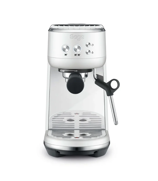 The Sage Bambino Espresso Machine in Sea Salt features a modern, minimalist design with a compact build. It includes a portafilter, steam wand, and intuitive controls. Equipped with a Thermojet Heating System, it expertly crafts microfoam milk while fitting neatly on kitchen countertops.