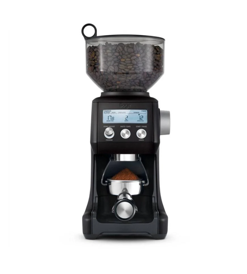 The Sage The Smart Grinder Pro in Black Truffle features Dosing IQ Technology, 60 grind settings, and a digital display. Its transparent top compartment holds beans, dispensing grounds into a portafilter. The sleek design adds modern style to any kitchen.