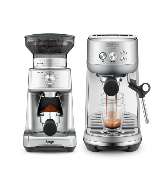 Two stainless steel coffee machines stand side by side. The left is the Sage The Bambino Bundle with a precision grinder and hopper, while the right has a ThermoJet heating system and an espresso maker with a portafilter dispensing two streams into a glass.