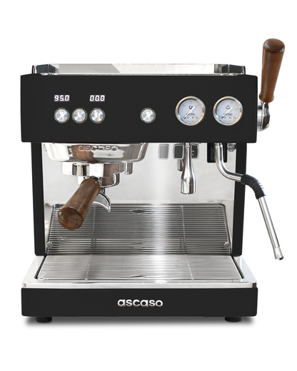 Professional black Ascaso Baby T Plus espresso machine with a portafilter and steam wand featuring wooden handles, digital temperature displays, dual pressure gauges, and a rotary pump.