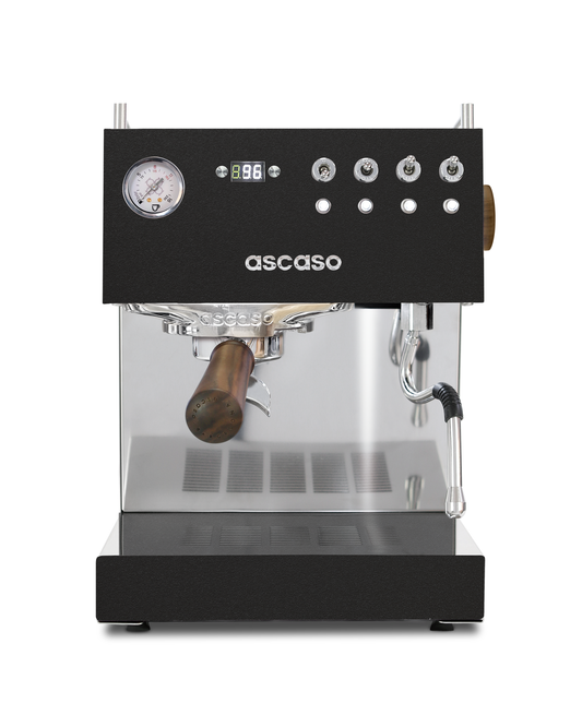 Ascaso Steel DUO PID espresso machine in black and stainless steel with a pressure gauge, digital temperature display, wooden portafilter handle, and volumetric control.